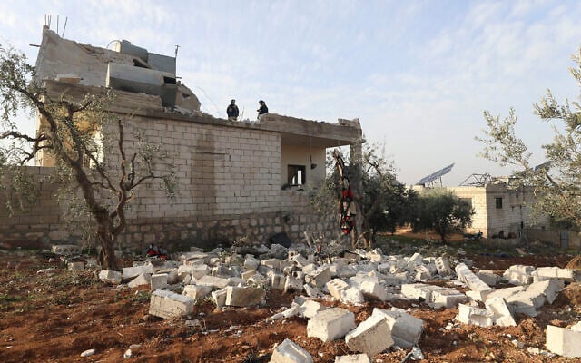 People examine a destroyed house after an operation by the US military in the Syrian village of Atmeh, in Idlib province, Syria, Feb. 3, 2022. (Ghaith Alsayed/AP) People examine a destroyed house after an operation by the US military in the Syrian village of Atmeh, in Idlib province, Syria, Feb. 3, 2022. (Ghaith Alsayed/AP)