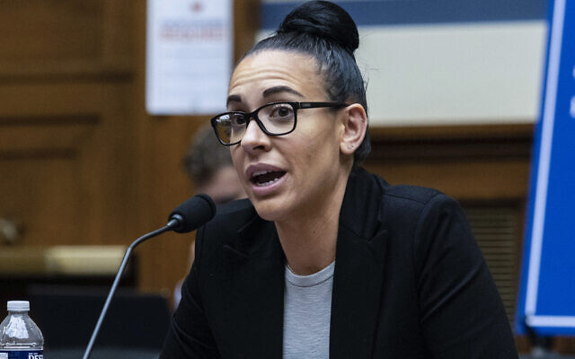 Emily Applegate, former marketing coordinator, premium client services and coordinator, ticket sales representative for the NFL's Washington Football Team, testifies before the House Oversight Committee during a roundtable "Examining the Washington Football Team's Toxic Workplace Culture" on Capitol Hill in Washington, Wednesday, Feb. 3, 2022. (Graeme Jennings/Pool via AP) Emily Applegate, former marketing coordinator, premium client services and coordinator, ticket sales representative for the NFL's Washington Football Team, testifies before the House Oversight Committee during a roundtable "Examining the Washington Football Team's Toxic Workplace Culture" on Capitol Hill in Washington, Wednesday, Feb. 3, 2022. (Graeme Jennings/Pool via AP)