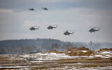 Russian military helicopters take part in the Belarusian and Russian joint military drills at Brestsky firing range, Belarus. (Russian Defense Ministry Press Service via AP)