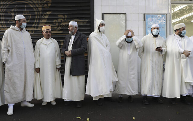 Imams from the Paris Mosque gather before paying their homage to the victims of the November 13, 2015 attacks, near the Bataclan concert hall in Paris, on Friday, November 12, 2021. (AP Photo/Adrienne Surprenant, File) Imams from the Paris Mosque gather before paying their homage to the victims of the November 13, 2015 attacks, near the Bataclan concert hall in Paris, on Friday, November 12, 2021. (AP Photo/Adrienne Surprenant, File)