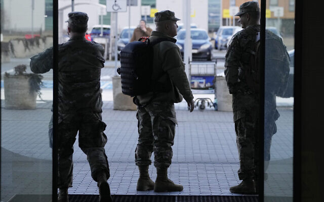 US Army officers after arrival at the Rzeszow-Jasionka airport in southeastern Poland, on February 5, 2022. (AP Photo/Czarek Sokolowski) US Army officers after arrival at the Rzeszow-Jasionka airport in southeastern Poland, on February 5, 2022. (AP Photo/Czarek Sokolowski)