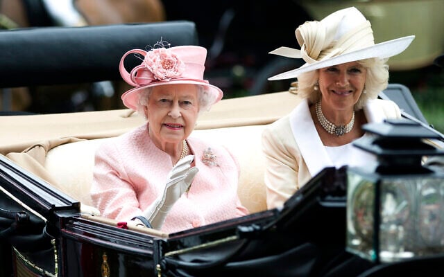 Britain's Queen Elizabeth II waves to the crowds with Camilla, Duchess of Cornwall, at right, as they arrive by carriage on the first day of the Royal Ascot horse race meeting in Ascot, England, June 18, 2013. (AP Photo/Alastair Grant, File) Britain's Queen Elizabeth II waves to the crowds with Camilla, Duchess of Cornwall, at right, as they arrive by carriage on the first day of the Royal Ascot horse race meeting in Ascot, England, June 18, 2013. (AP Photo/Alastair Grant, File)