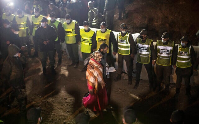 Parents of 5-year-old Rayan walk towards the tunnel as their son's body was being retrieved, after he fell into a hole and was stuck there for several days, in the village of Ighran in Morocco's Chefchaouen province, Feb. 5, 2022. (AP Photo/Mosa'ab Elshamy) Parents of 5-year-old Rayan walk towards the tunnel as their son's body was being retrieved, after he fell into a hole and was stuck there for several days, in the village of Ighran in Morocco's Chefchaouen province, Feb. 5, 2022. (AP Photo/Mosa'ab Elshamy)