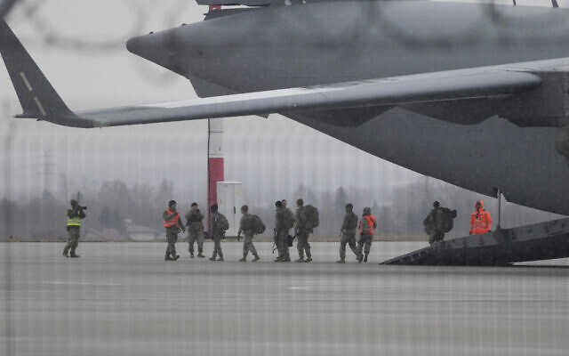 US Army troops of the 82nd Airborne Division unloading vehicles from a transport plane after arriving from Fort Bragg, at the Rzeszow-Jasionka airport in southeastern Poland, on February 6, 2022. (AP Photo/Czarek Sokolowski) US Army troops of the 82nd Airborne Division unloading vehicles from a transport plane after arriving from Fort Bragg, at the Rzeszow-Jasionka airport in southeastern Poland, on February 6, 2022. (AP Photo/Czarek Sokolowski)