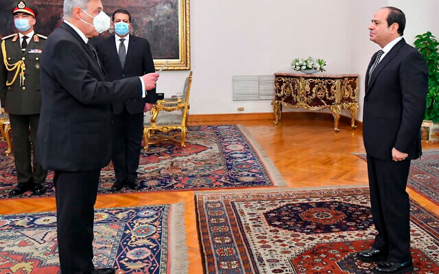 Egyptian President Abdel-Fattah el-Sissi, right, swears in Judge Boulos Fahmy, as the first-ever Coptic Christian to head the country’s highest court, in Cairo, Egypt, Wednesday, Feb. 9, 2022. (Egyptian Presidency Media Office via AP)