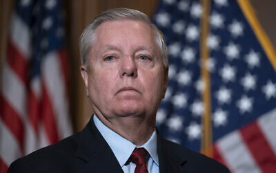 Senator Lindsey Graham waits to speak to reporters at the US Capitol in Washington, DC, on February 10, 2022. (J. Scott Applewhite/AP) Senator Lindsey Graham waits to speak to reporters at the US Capitol in Washington, DC, on February 10, 2022. (J. Scott Applewhite/AP)