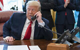 Illustrative: In this October 23, 2020 photo, then-US president Donald Trump talks on a phone during a call with the leaders of Sudan and Israel in the Oval Office of the White House, in Washington, DC. (AP Photo/Alex Brandon)