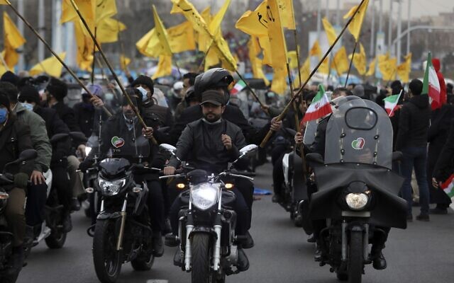 Men on motorcycles attend the annual rally commemorating the anniversary of Iran's 1979 Islamic Revolution at the Azadi (freedom) Square in Tehran, Iran, Friday, Feb. 11, 2022 (AP Photo/Vahid Salemi)