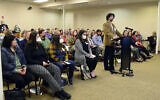 James Cockrum speaks before the McMinn County School Board in a packed meeting room, Thursday, Feb. 10, 2022, in Athens, Tenn. The McMinn County School Board heard from concerned citizens about the removal of the Pulitzer Prize-winning graphic novel about the Holocaust, “Maus," from the district's curriculum at the meeting. (Robin Rudd/Chattanooga Times Free Press via AP)