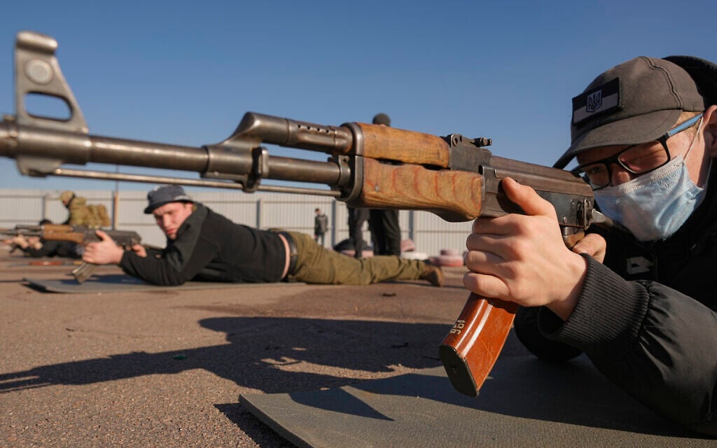 Men hold weapons during a basic combat training for civilians, organized by the Special Forces Unit Azov, of Ukraine's National Guard, in Mariupol, Donetsk region, eastern Ukraine, February 13, 2022. (AP Photo/Vadim Ghirda) Men hold weapons during a basic combat training for civilians, organized by the Special Forces Unit Azov, of Ukraine's National Guard, in Mariupol, Donetsk region, eastern Ukraine, February 13, 2022. (AP Photo/Vadim Ghirda)