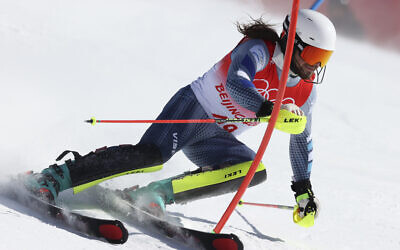 Barnabas Szollos of Israel passes a gate during the first run of the men's slalom at the 2022 Winter Olympics, Feb. 16, 2022, in the Yanqing district of Beijing. (AP Photo/Alessandro Trovati)