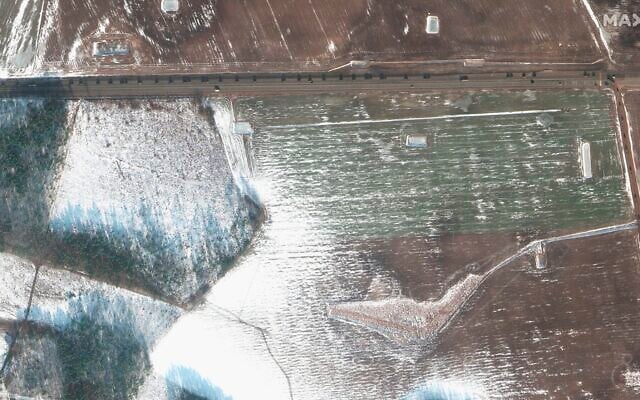 This February 16, 2022 satellite image provided by Maxar Technologies shows a military convoy headed westbound at Rechitsa in Belarus. (Satellite image ©2022 Maxar Technologies via AP)