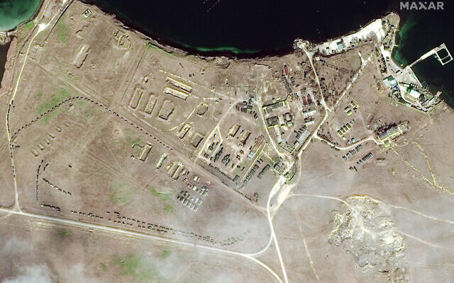 This February 15, 2022 satellite image provided by Maxar Technologies shows military equipment positioned in convoy at Lake Donuzlav in Crimea. (Satellite image ©2022 Maxar Technologies via AP) This February 15, 2022 satellite image provided by Maxar Technologies shows military equipment positioned in convoy at Lake Donuzlav in Crimea. (Satellite image ©2022 Maxar Technologies via AP)