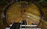 Engineers work on the conversion of a Boeing 767 passenger plane to a cargo plane at the Israel Aerospace Industries in Lod, near Tel Aviv, Israel, on January 25, 2022. (AP Photo/Oded Balilty)