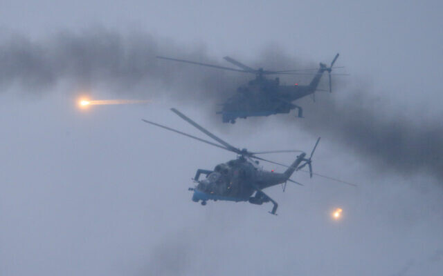 Military helicopters fly over the Osipovichi training ground during the Union Courage-2022 Russia-Belarus military drills near Osipovichi, Belarus, on February 17, 2022. (AP Photo/Alexander Zemlianichenko Jr.) Military helicopters fly over the Osipovichi training ground during the Union Courage-2022 Russia-Belarus military drills near Osipovichi, Belarus, on February 17, 2022. (AP Photo/Alexander Zemlianichenko Jr.)