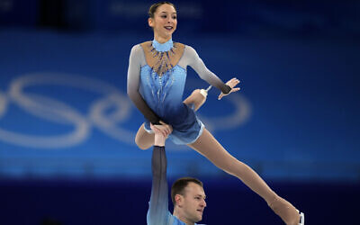 Hailey Kops and Evgeni Krasnopolski, of Israel, compete in the pairs free skate program during the figure skating competition at the 2022 Winter Olympics, February 19, 2022, in Beijing. (AP Photo/Natacha Pisarenko)