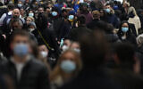 Shoppers walk down Oxford Street, Europe's busiest shopping street, in London, Dec. 23, 2021 (AP Photo/Frank Augstein, File)