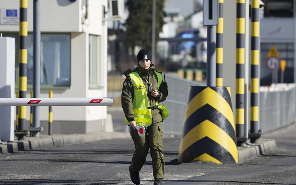 A Polish border guard at the Medyka crossing into Ukraine seen on the Polish side, Feb. 19, 2022. (Czarek Sokolowski/AP) A Polish border guard at the Medyka crossing into Ukraine seen on the Polish side, Feb. 19, 2022. (Czarek Sokolowski/AP)