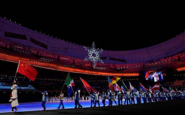 Flag bearers walk into the stadium for the closing ceremony of the 2022 Winter Olympics, Feb. 20, 2022, in Beijing. (AP Photo/Natacha Pisarenko) Flag bearers walk into the stadium for the closing ceremony of the 2022 Winter Olympics, Feb. 20, 2022, in Beijing. (AP Photo/Natacha Pisarenko)