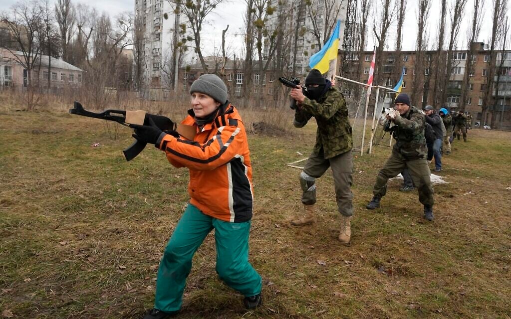Civilians train with members of the Georgian Legion, a paramilitary unit formed mainly by ethnic Georgian volunteers to fight against Russian forces in Ukraine in 2014, in Kyiv, Ukraine, Feb. 19, 2022. (Efrem Lukatsky/AP)