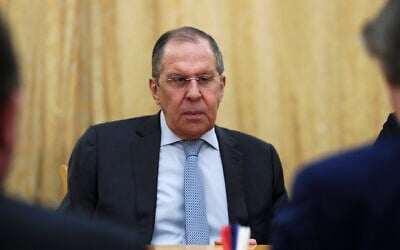 In this handout photo released by Russian Foreign Ministry Press Service, Russian Foreign Minister Sergey Lavrov listens to the UN special envoy for Syria Geir Pedersen, right back to a camera, during their talks in Moscow, Russia, February 23, 2022. (Russian Foreign Ministry Press Service via AP)