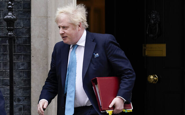 Britain's Prime Minister Boris Johnson leaves 10 Downing Street as he makes his way to parliament, to attend Prime Minister's Questions, in London, Feb. 23, 2022. (Alberto Pezzali/AP)) Britain's Prime Minister Boris Johnson leaves 10 Downing Street as he makes his way to parliament, to attend Prime Minister's Questions, in London, Feb. 23, 2022. (Alberto Pezzali/AP))