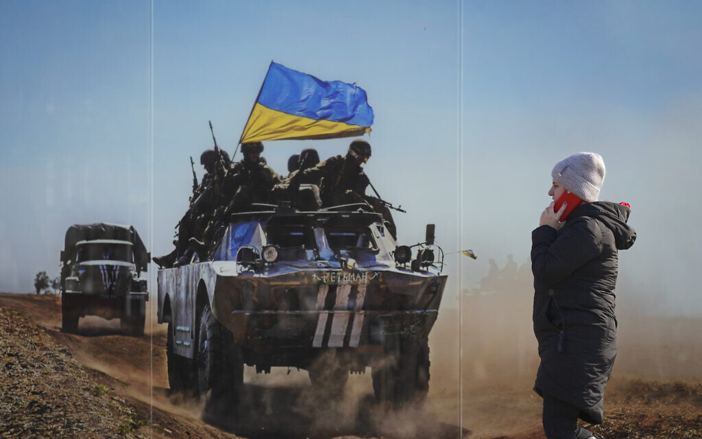 A woman walks by a large print at a photographic memorial for those killed in the confrontation between Ukraine's military and the pro-Russia separatist forces in Sievierodonetsk, Luhansk region, eastern Ukraine, Feb. 23, 2022. (Vadim Ghirda/AP) A woman walks by a large print at a photographic memorial for those killed in the confrontation between Ukraine's military and the pro-Russia separatist forces in Sievierodonetsk, Luhansk region, eastern Ukraine, Feb. 23, 2022. (Vadim Ghirda/AP)