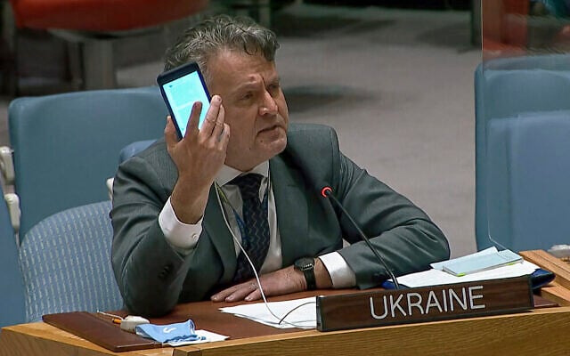 In this image from UNTV video, Ukraine's Ambassador to the United Nations Sergiy Kyslytsya, holds up a phone as he speaks an emergency meeting of the UN Security Council at UN headquarters, Feb. 23, 2022. (UNTV via AP) In this image from UNTV video, Ukraine's Ambassador to the United Nations Sergiy Kyslytsya, holds up a phone as he speaks an emergency meeting of the UN Security Council at UN headquarters, Feb. 23, 2022. (UNTV via AP)
