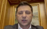 In this handout photo taken from video provided by the Ukrainian Presidential Press Office, Ukrainian President Volodymyr Zelensky addresses to the nation in Kyiv, Ukraine, Feb. 24, 2022. (Ukrainian Presidential Press Office via AP)