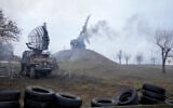 Damaged radar arrays and other equipment is seen at Ukrainian military facility outside Mariupol, Ukraine, on February 24, 2022. (AP Photo/Sergei Grits)