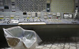 An operator's armchair covered with plastic sits in an empty control room of the 3rd reactor at the Chernobyl nuclear plant, in Chernobyl, Ukraine, on April 20, 2018. (AP Photo/Efrem Lukatsky, File)