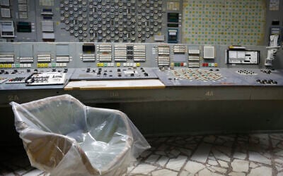 An operator's armchair covered with plastic sits in an empty control room of the 3rd reactor at the Chernobyl nuclear plant, in Chernobyl, Ukraine, on April 20, 2018. (AP Photo/Efrem Lukatsky, File)