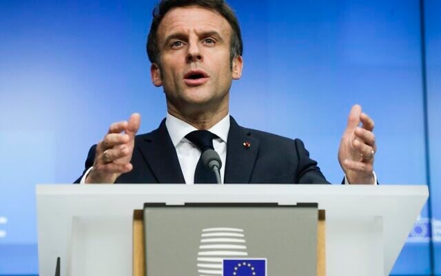 French President Emmanuel Macron speaks during a media conference after an extraordinary EU summit on Ukraine in Brussels, on Friday, February 25, 2022. (Olivier Hoslet/Pool Photo via AP)