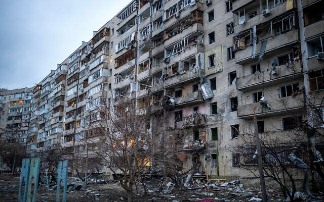 View of a building damaged following a rocket attack the city of Kyiv, Ukraine, February 25, 2022. (AP Photo/Emilio Morenatti)