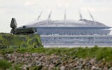 File - A Pantsir anti-aircraft missile system, left, guards the air space above 'Saint Petersburg' stadium in St. Petersburg, Russia,  June 12, 2018 (AP Photo/Dmitri Lovetsky, File)
