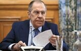 In this handout photo released by Russian Foreign Ministry Press Service, Russian Foreign Minister Sergey Lavrov speaks during a meeting with top envoys from the separatist regions in eastern Ukraine, Vladislav Deinego of the Luhansk People's Republic and Sergei Peresada, of the Donetsk People's Republic (DPR), in Moscow, Russia, Friday, Feb. 25, 2022 (Russian Foreign Ministry Press Service via AP)