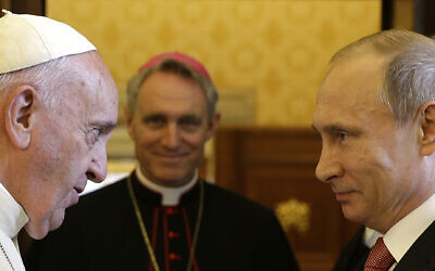 FILE - Pope Francis meets Russian President Vladimir Putin on the occasion of their private audience at the Vatican on June 10, 2015. Pope Francis went to the Russian Embassy on Friday, Feb. 25, 2022 to personally “express his concern about the war,” the Vatican said, in an extraordinary, hands-on papal gesture that has no recent precedent. (AP Photo/Gregorio Borgia, Pool)