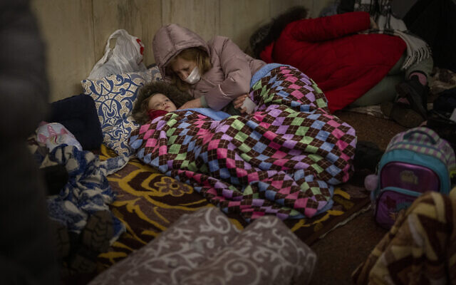 People rest in the Kyiv subway, using it as a bomb shelter in Kyiv, Ukraine, on Thursday, February 24, 2022. (AP Photo/Emilio Morenatti) People rest in the Kyiv subway, using it as a bomb shelter in Kyiv, Ukraine, on Thursday, February 24, 2022. (AP Photo/Emilio Morenatti)