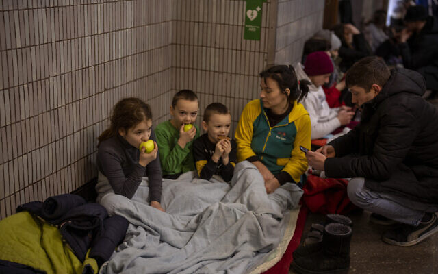 A family sits in the Kyiv subway, using it as a bomb shelter in Kyiv, Ukraine, on February 25, 2022. (AP Photo/Emilio Morenatti) A family sits in the Kyiv subway, using it as a bomb shelter in Kyiv, Ukraine, on February 25, 2022. (AP Photo/Emilio Morenatti)