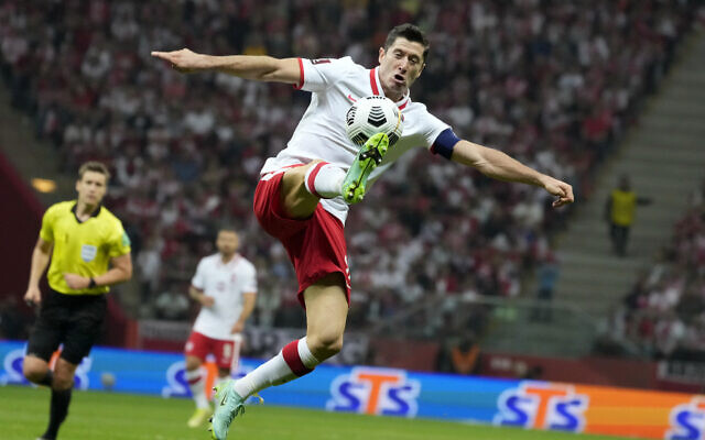 Poland's Robert Lewandowski controls the ball during the World Cup 2022 group I qualifying soccer match between Poland and England, at the Narodowy stadium in Warsaw, on September 8, 2021. (AP Photo/Czarek Sokolowski, File) Poland's Robert Lewandowski controls the ball during the World Cup 2022 group I qualifying soccer match between Poland and England, at the Narodowy stadium in Warsaw, on September 8, 2021. (AP Photo/Czarek Sokolowski, File)