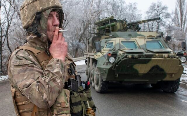 A Ukrainian soldier smokes a cigarette on his position at an armored vehicle outside Kharkiv, Ukraine, Feb. 26, 2022. (Andrew Marienko/AP) A Ukrainian soldier smokes a cigarette on his position at an armored vehicle outside Kharkiv, Ukraine, Feb. 26, 2022. (Andrew Marienko/AP)