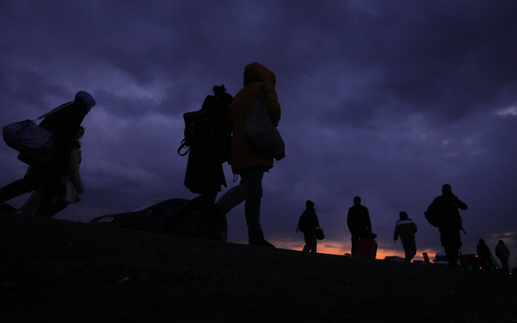 Refugees fleeing conflict in neighboring Ukraine arrive to Przemysl, Poland, February 26, 2022. (AP Photo/Petr David Josek)
