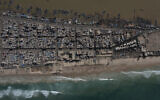 Houses lay between the Senegal river, top, and the Atlantic Ocean beach that has been affected by erosion in Saint Louis, Senegal, Nov. 3, 2021. (Leo Correa/AP)