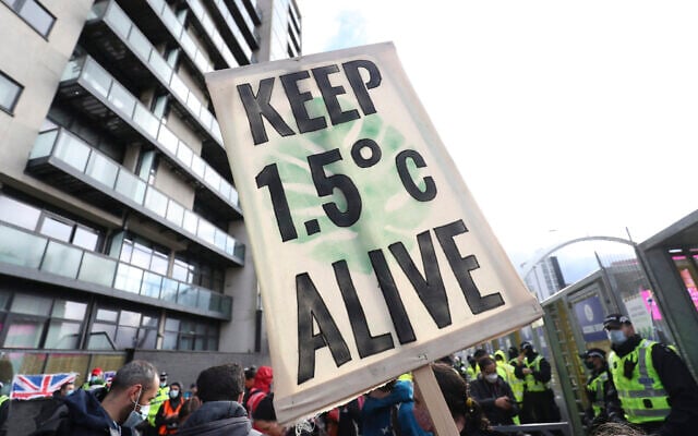 Climate activists take part in a demonstration outside the venue of the COP26 UN Climate Summit in Glasgow, Scotland, Friday, Nov. 12, 2021. (Scott Heppell/AP)