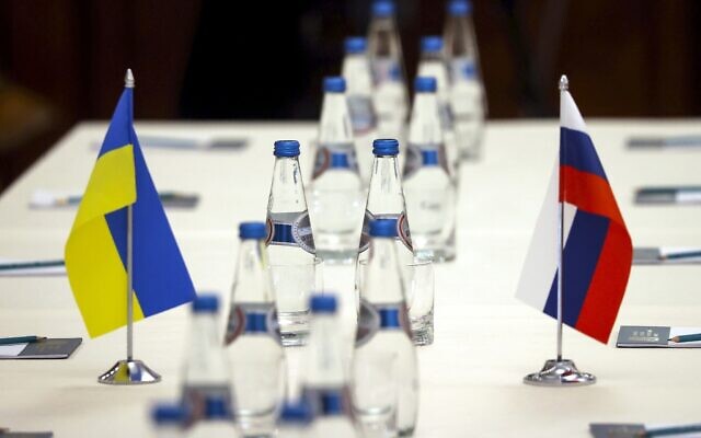 Ukrainian and Russian national flags are placed on the table ahead of peace talks between Russian and Ukrainian delegations in a guest house in the Gomel region, Belarus, on Monday, February 28, 2022. (Sergei Kholodilin/BelTA Pool Photo via AP) Ukrainian and Russian national flags are placed on the table ahead of peace talks between Russian and Ukrainian delegations in a guest house in the Gomel region, Belarus, on Monday, February 28, 2022. (Sergei Kholodilin/BelTA Pool Photo via AP)