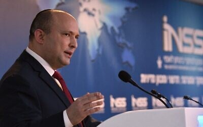 Prime Minister Naftali Bennett speaks at the annual Annual International Conference of the Institute for National Security Studies, on February 1, 2022. (Haim Zach/GPO)