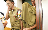 Illustrative: Military Police soldiers escort an arrested soldier at the Jaffa Military Court, on August 18, 2009. (Flash90)