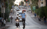 An illustrative photo of a person riding an electric scooter in Tel Aviv, November 27, 2019. (Miriam Alster/FLASH90)