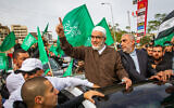 Sheikh Raed Salah, center, leader of the northern branch of the Islamic Movement in Israel, arrives after his release from prison in Umm al-Fahm, December 13, 2021. (Flash90)