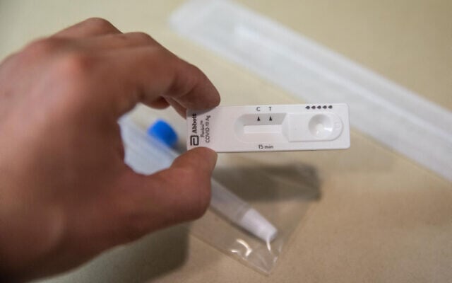 An illustration of a COVID-19 rapid antigen home test kit in Jerusalem on January 9, 2022. (Noam Revkin Fenton/Flash90) An illustration of a COVID-19 rapid antigen home test kit in Jerusalem on January 9, 2022. (Noam Revkin Fenton/Flash90)